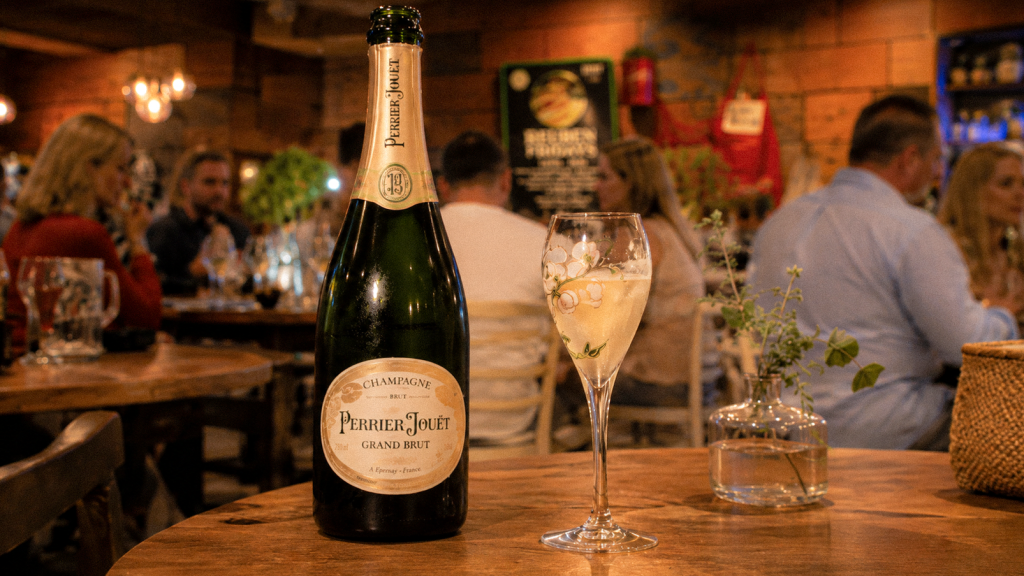 Perrier-Jouët Champagne bottle and flute on a table at Henry and the Fox for a Champagne long lunch event