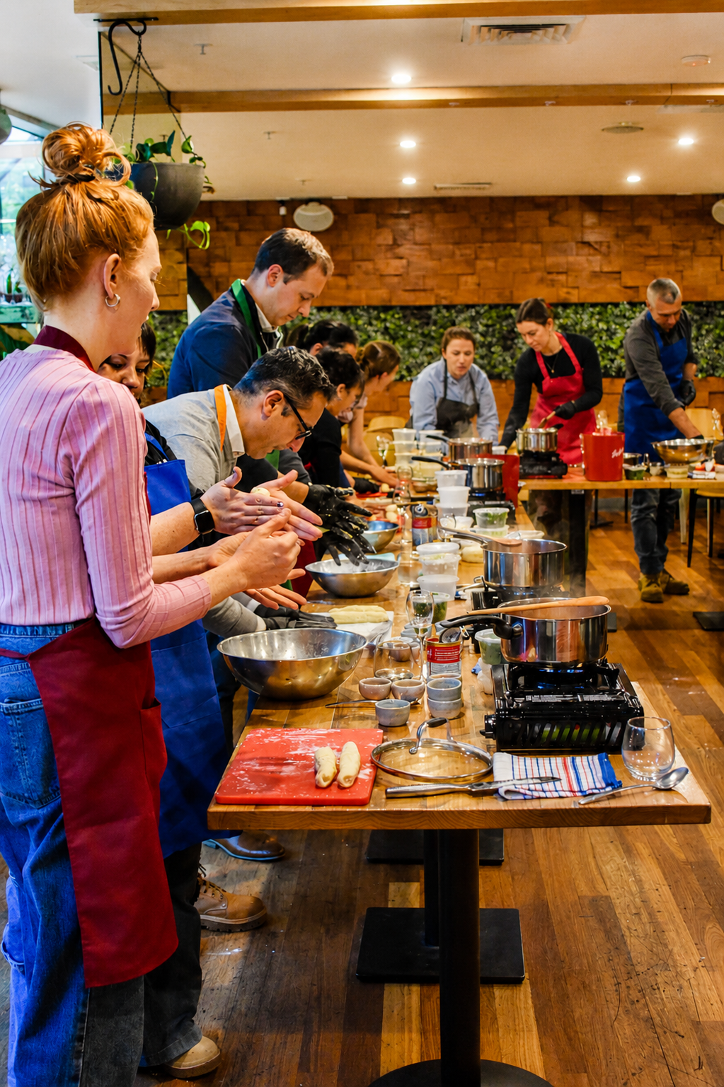 Guests making fresh gnocchi during a hands-on cooking masterclass at Henry and the Fox