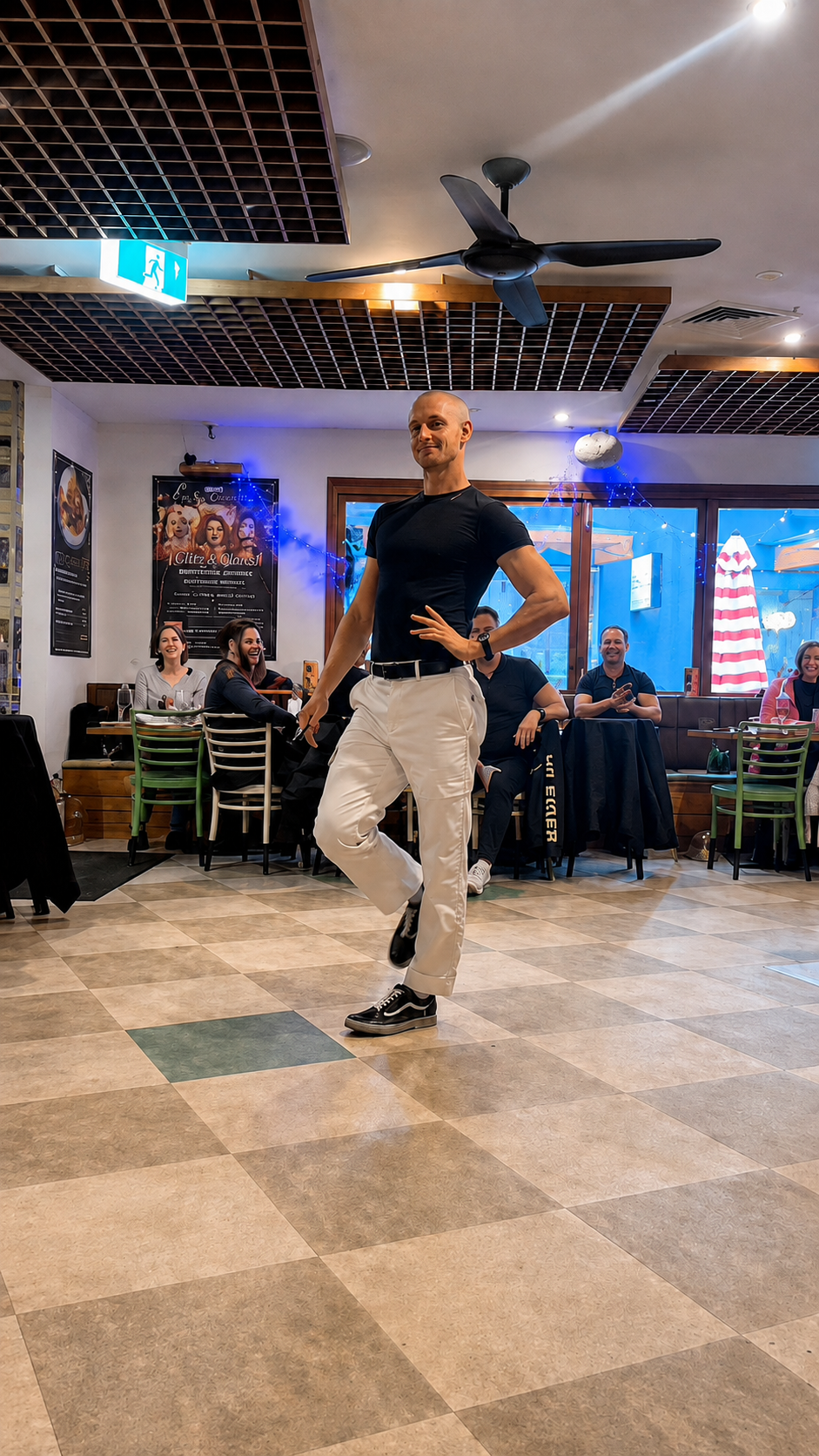 A guest enjoying a runway moment during Sip, Sip Queens at Henry and the Fox
